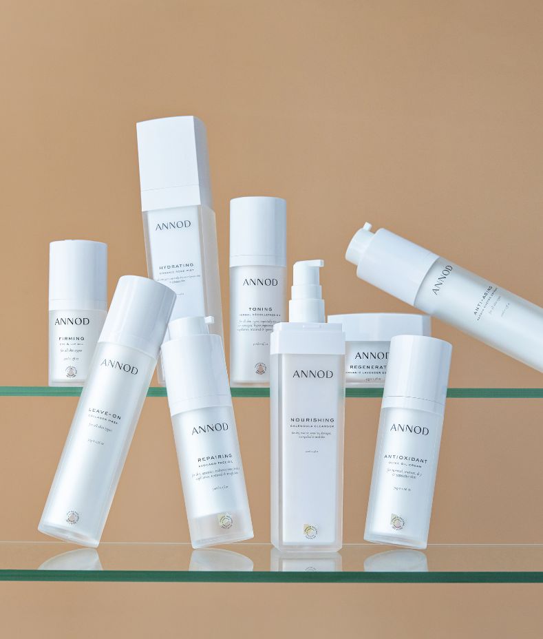 The complete Annod natural skincare range for the Skincare Club subscription, displayed on glass shelves