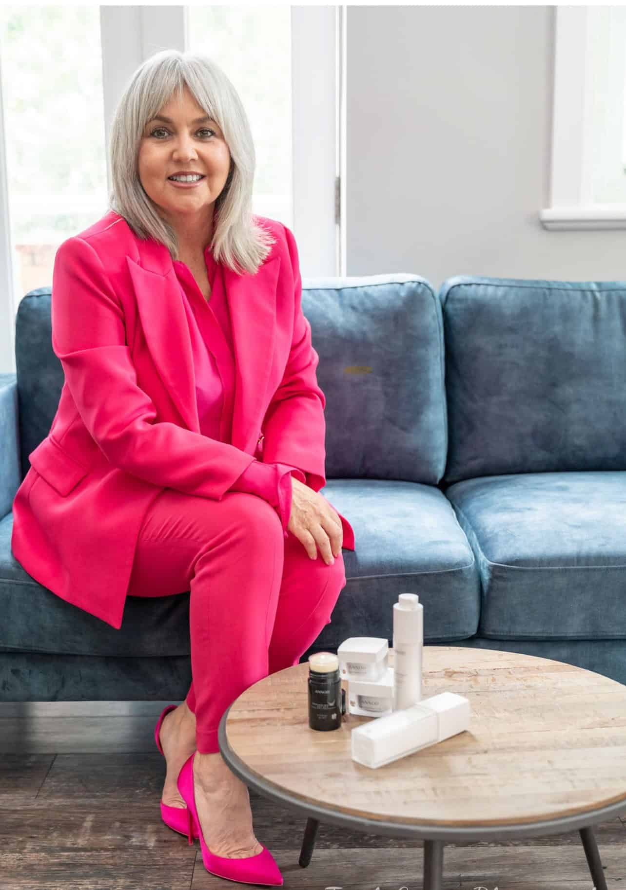 donna on longe with products